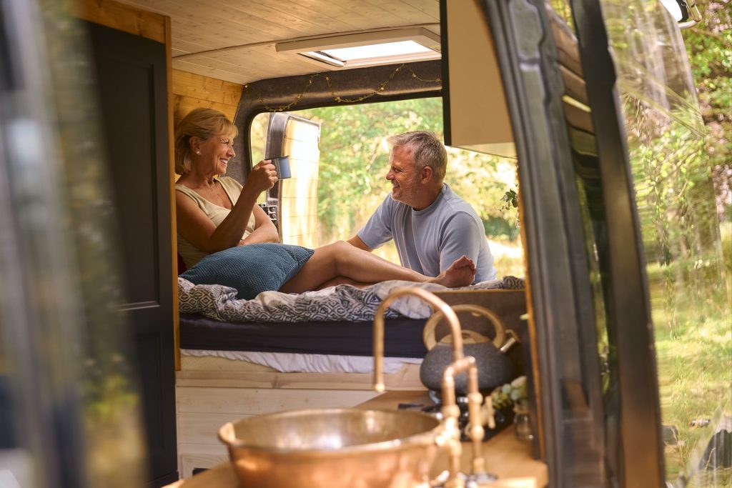 senior couple camping in countryside relaxing drin 2023 11 27 05 35 05 utc